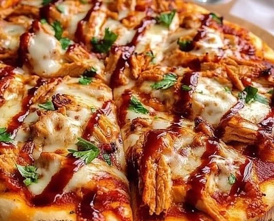 Cheesy BBQ chicken pizza topped with tender chicken and melted cheese