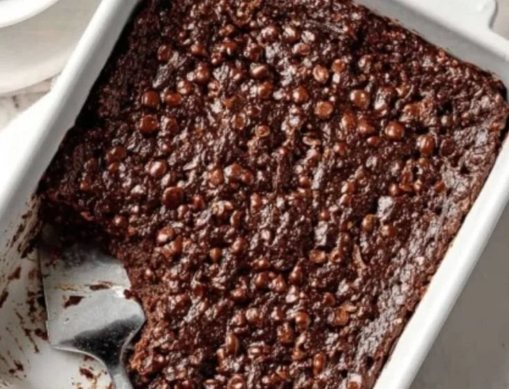 Delicious chocolate brownie oatmeal bake topped with chocolate drizzle