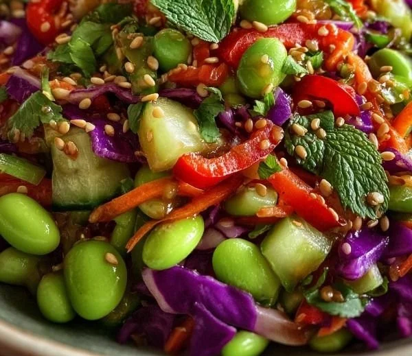 A vibrant bowl of crunchy Asian edamame salad with fresh vegetables