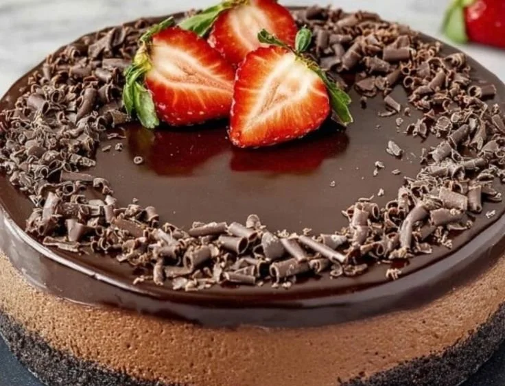 Delicious slice of decadent chocolate cheesecake with rich chocolate topping