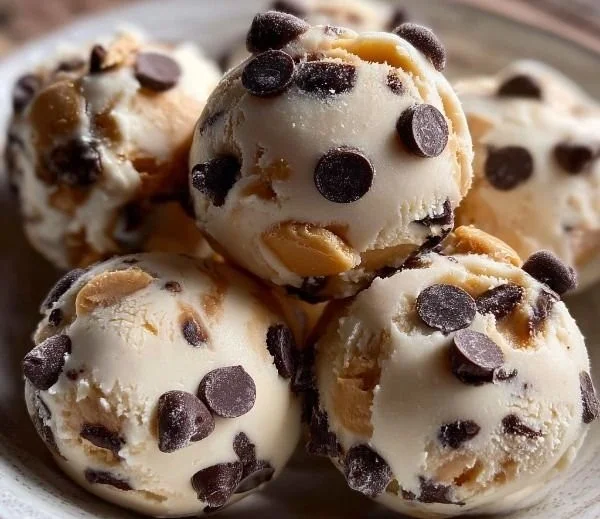 Frozen Greek yogurt peanut butter bites with chocolate chips on a plate