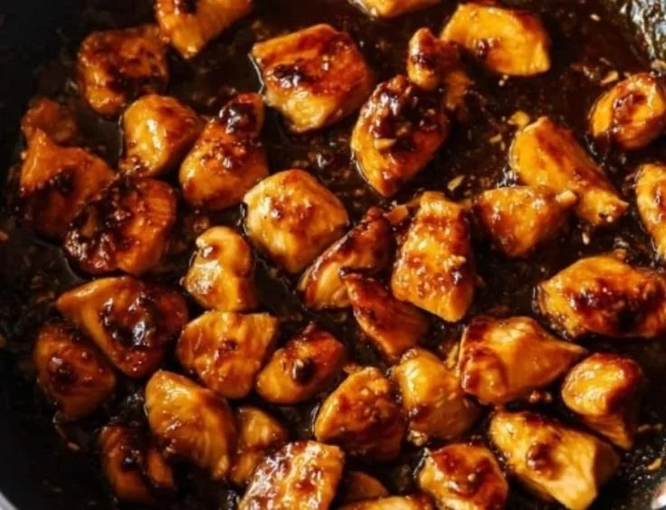 Healthy sesame chicken stir-fry with colorful vegetables and sesame seeds