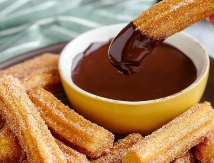Delicious homemade churros served with chocolate dipping sauce.