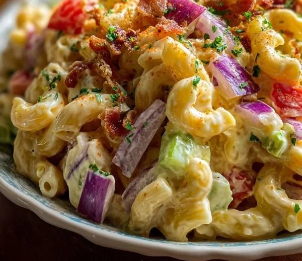 Delicious macaroni salad with colorful veggies and creamy dressing.