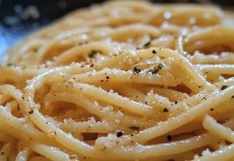 Delicious garlic butter pasta served in a bowl with herbs and seasonings