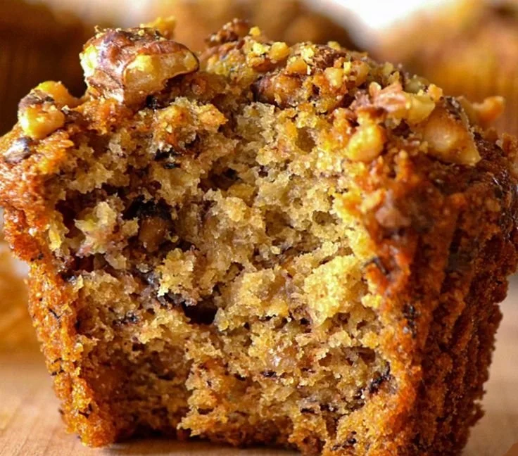 Freshly baked Banana Nut Muffins with walnuts and ripe bananas