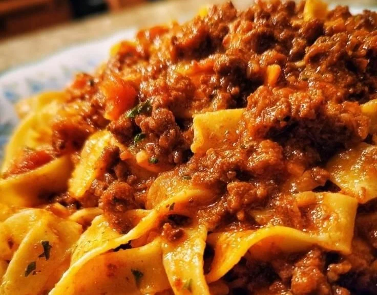 Delicious bowl of homemade Bolognese Sauce served over spaghetti