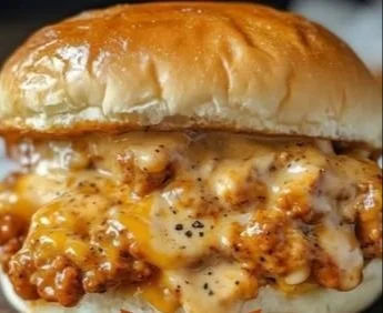 Plate of Cajun Chicken Sloppy Joes topped with fresh ingredients