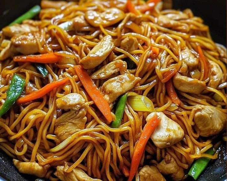 Delicious Chicken Lo Mein dish served in a bowl with vegetables and noodles