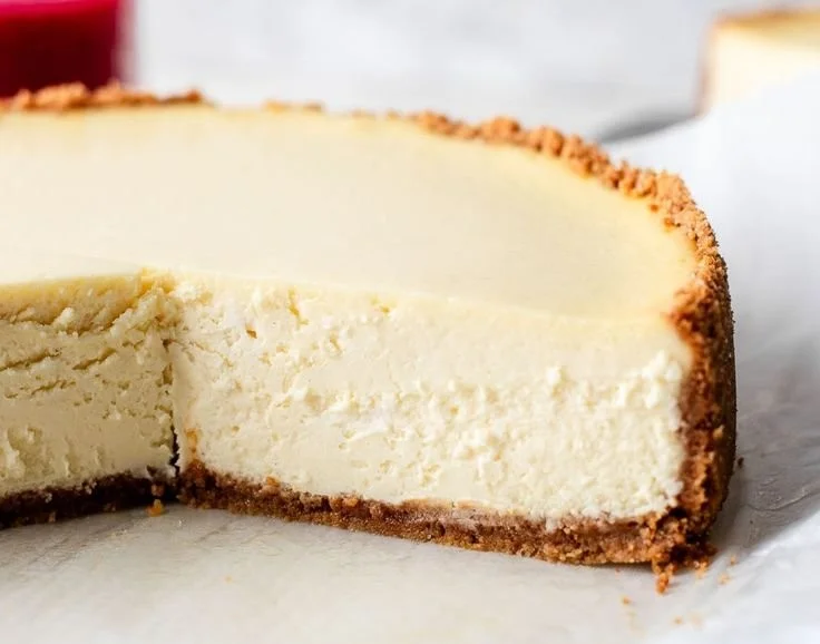 Slice of classic cheesecake topped with fresh berries