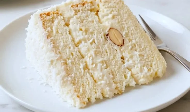 Delicious Coconut Raffaello Cake with coconut flakes and creamy filling