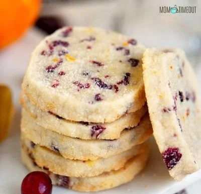 Freshly baked Cranberry Orange Shortbread Cookies on a plate