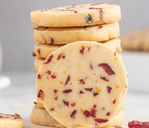 Cranberry Orange Shortbread Cookies arranged on a festive plate