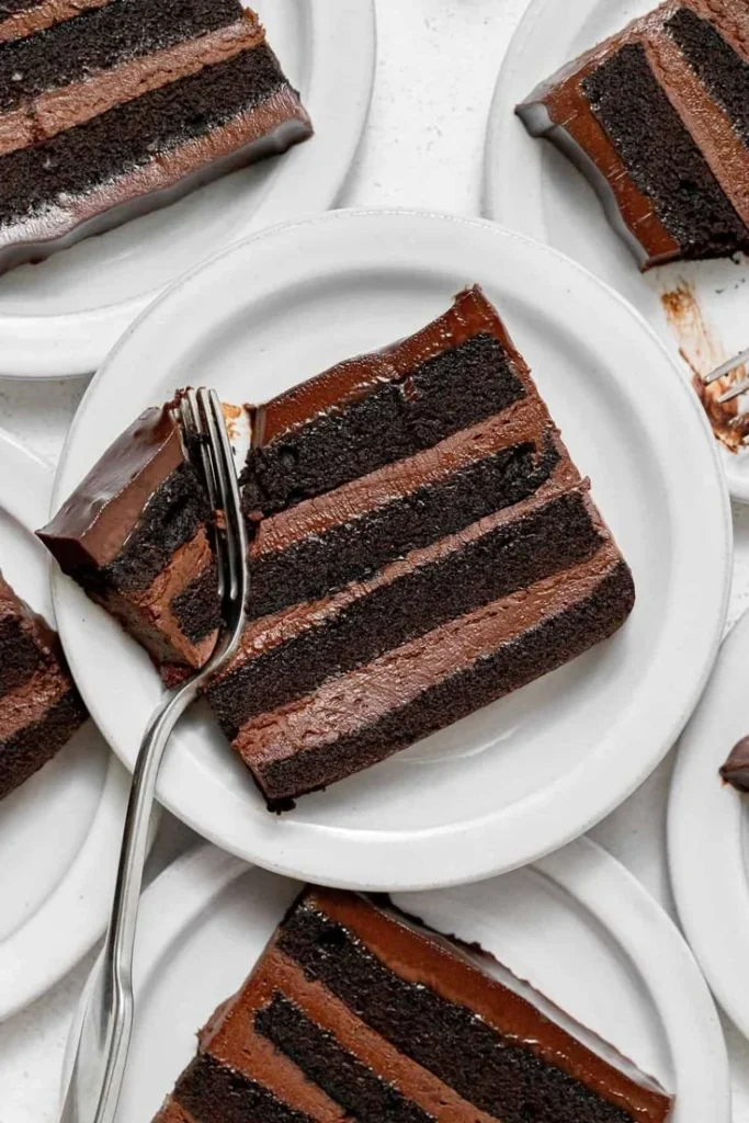 Delicious Dark Chocolate Mousse Cake layered with velvety chocolate topping