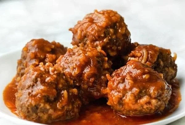 Delicious easy porcupine meatballs served with sauce on a plate