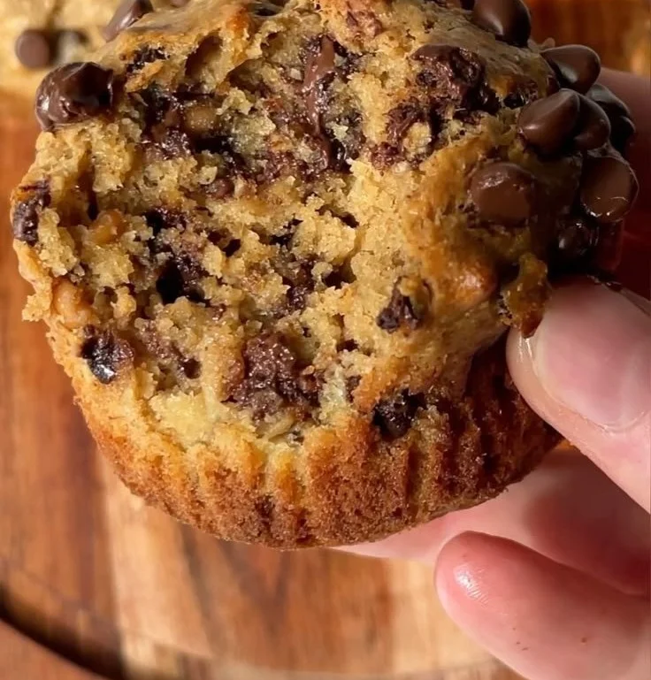 Healthy peanut butter banana muffins on a wooden table