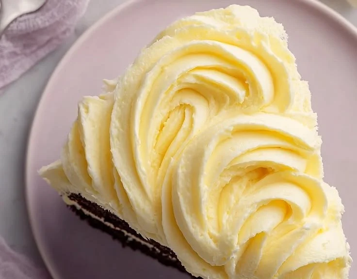 Delicious homemade banana pudding frosting spread on a cake