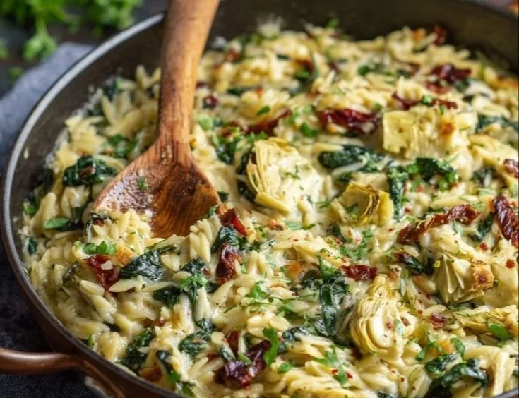 Creamy one pan spinach and artichoke orzo bake served in a dish