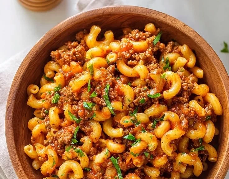 One-Pot Beefaroni dish in a bowl with cheese and herbs