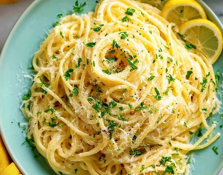 Delicious bowl of creamy Parmesan Lemon Pasta garnished with fresh herbs