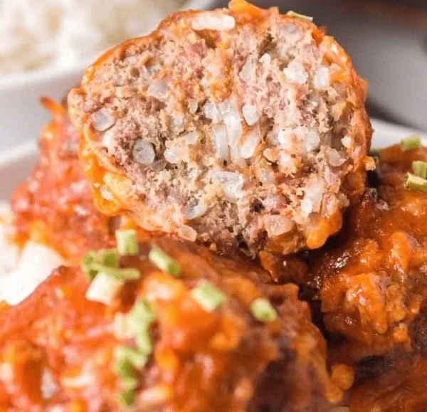 Delicious porcupine meatballs made with ground beef and rice served in a dish.