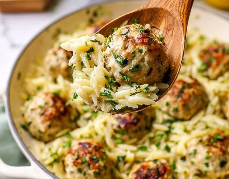 Delicious Greek chicken meatballs served with lemon orzo in a colorful dish