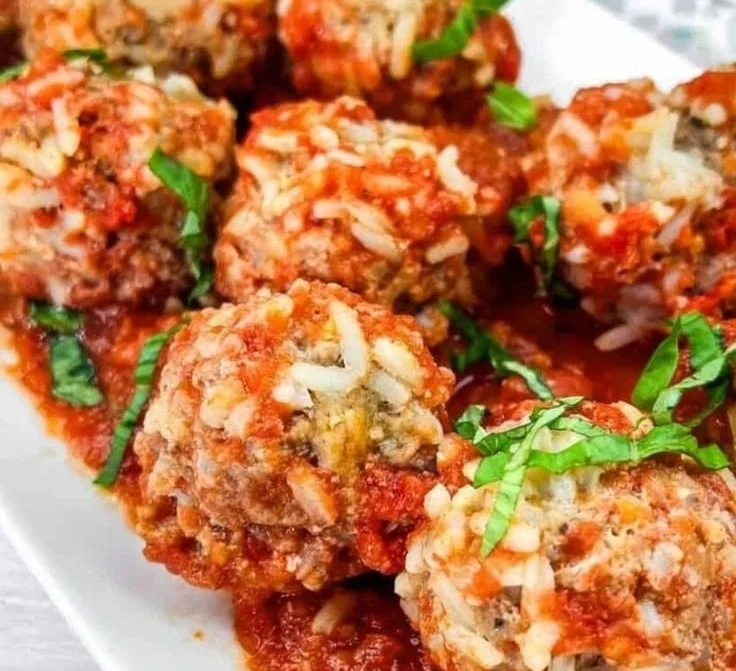 Delicious Slow Cooker Porcupine Meatballs served with sauce.
