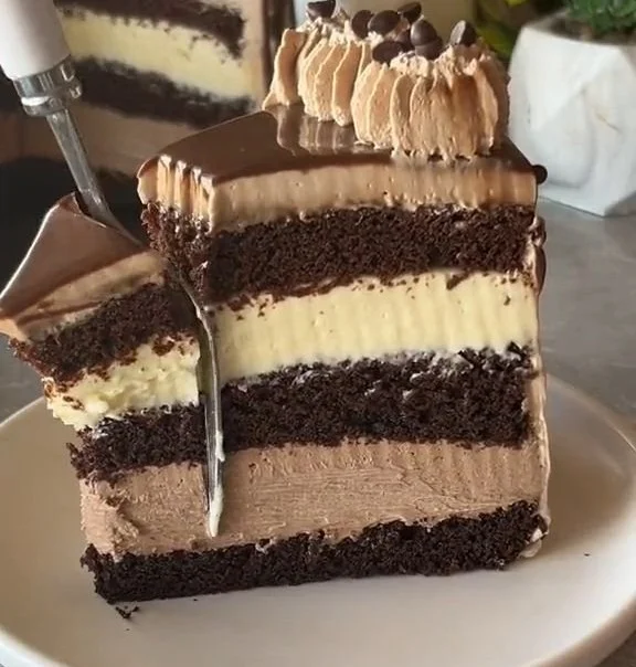 Ultimate Chocolate Mousse Cheesecake with rich chocolate layers and whipped mousse topping