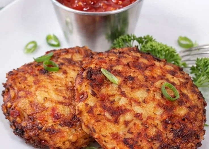 Crispy air fryer cauliflower hash browns on a plate