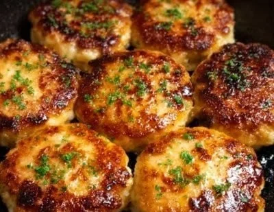 Juicy air fryer turkey burgers on a plate with fresh veggies