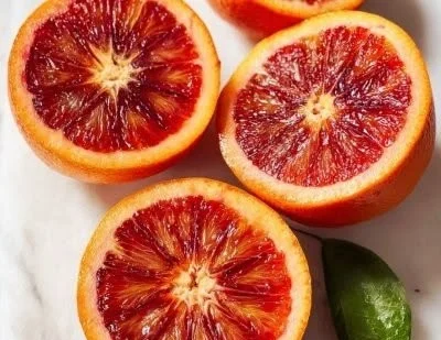 Delicious baked grapefruit dessert topped with sugar and a sprinkle of cinnamon