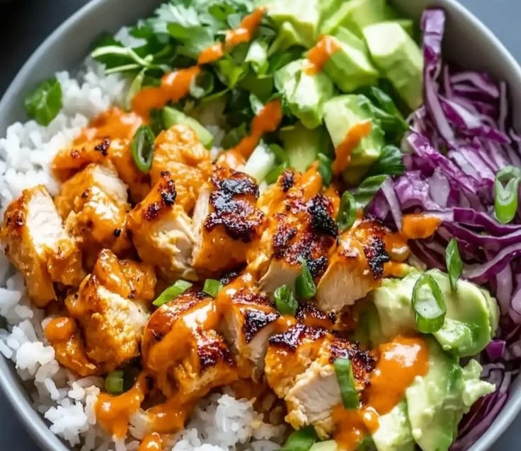 Delicious Bang Bang Chicken Bowl topped with fresh ingredients.