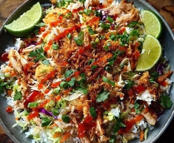 Bang Bang Chicken Salad topped with crispy rice for added crunch and flavor