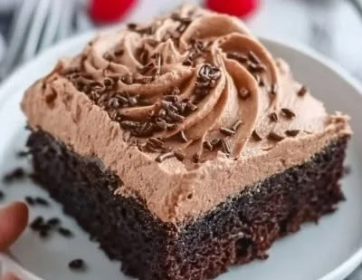 Delicious homemade Chocolate Mousse Cake with creamy chocolate topping