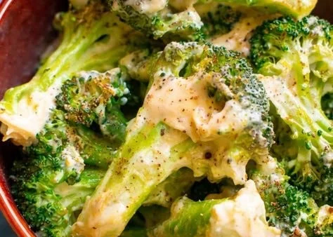 Creamy garlic Parmesan broccoli dish garnished and ready to serve.