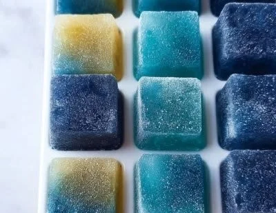 A tray of colorful smoothie cubes ready to blend for healthy drinks