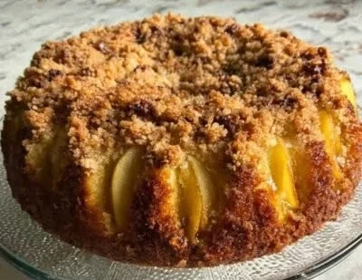 Delicious slice of easy Maple Pear Cake with pear slices and maple drizzle on top.