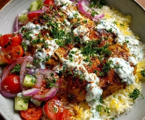 Greek Chicken Rice Bowl with Creamy Tzatziki served in a rustic bowl