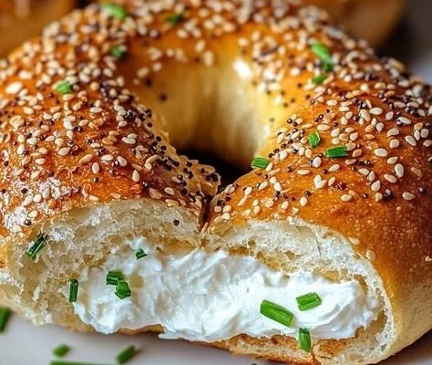Fresh homemade bagels on a wooden surface ready for breakfast