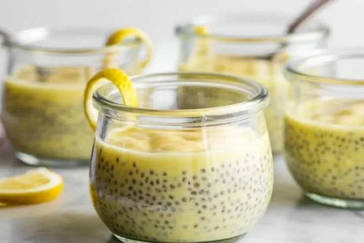Healthy lemon chia pudding served in a glass with fresh lemon slices