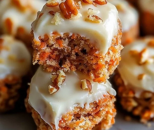 No Bake Carrot Cake Bites topped with cream cheese frosting and walnuts