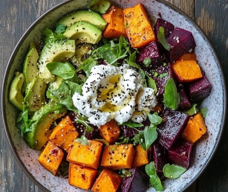 Pressure cooker roasted beet and ricotta salad garnished with fresh herbs