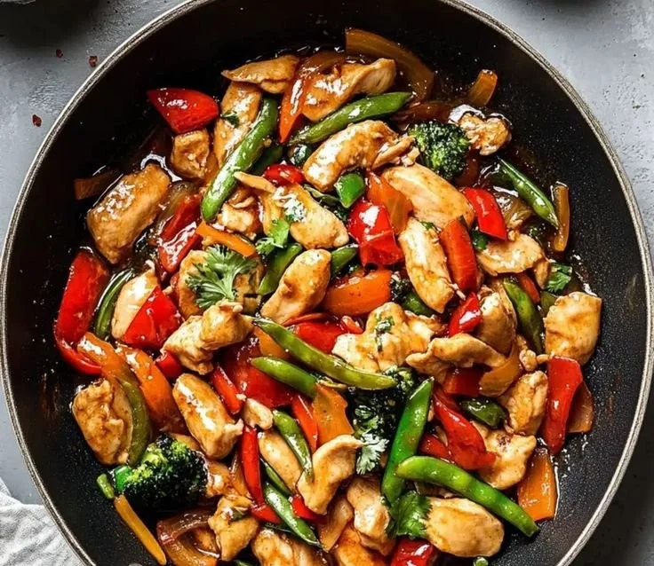 Savory chicken stir fry with colorful vegetables on a plate