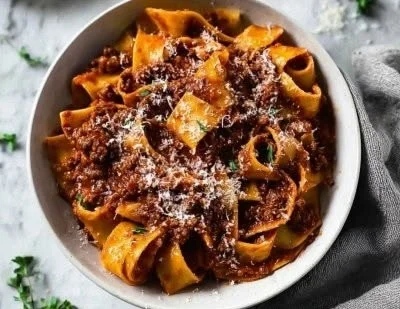 One pot short rib bolognese dish served in a cozy setting