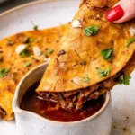 Delicious slow cooker birria tacos with savory broth