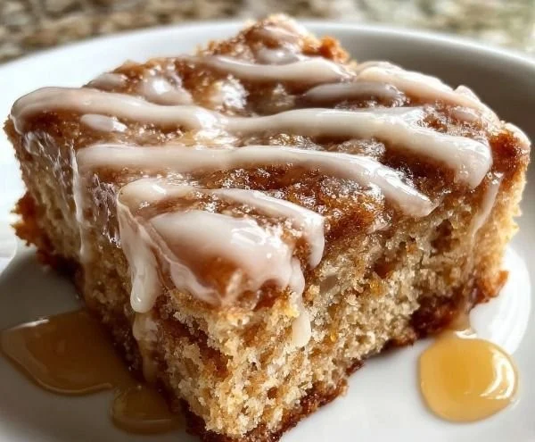 Soft baked maple donut bars drizzled with maple icing and topped with nuts.