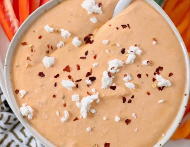 Delicious Spicy Feta Dip (Tirokafteri) served with pita and vegetables