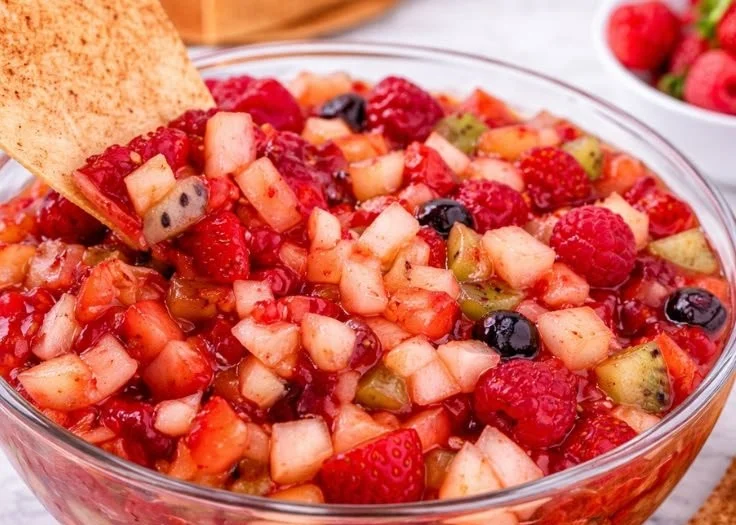 Sweet fruit salsa with cinnamon sugar tortilla chips in a colorful bowl
