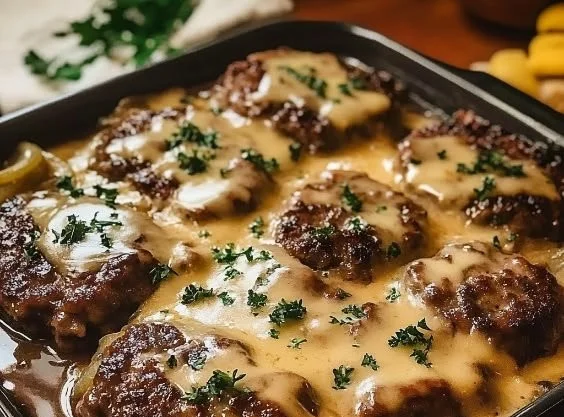 Amish Hamburger Steak Bake served with savory gravy and vegetables