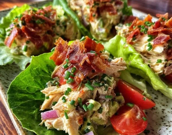 BLT Chicken Salad Lettuce Wraps with chicken, bacon, lettuce, and tomatoes
